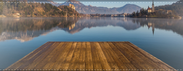 A wooden dock on a lake in autumn